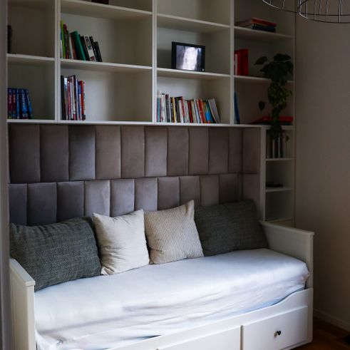 Book cabinet around a bed 